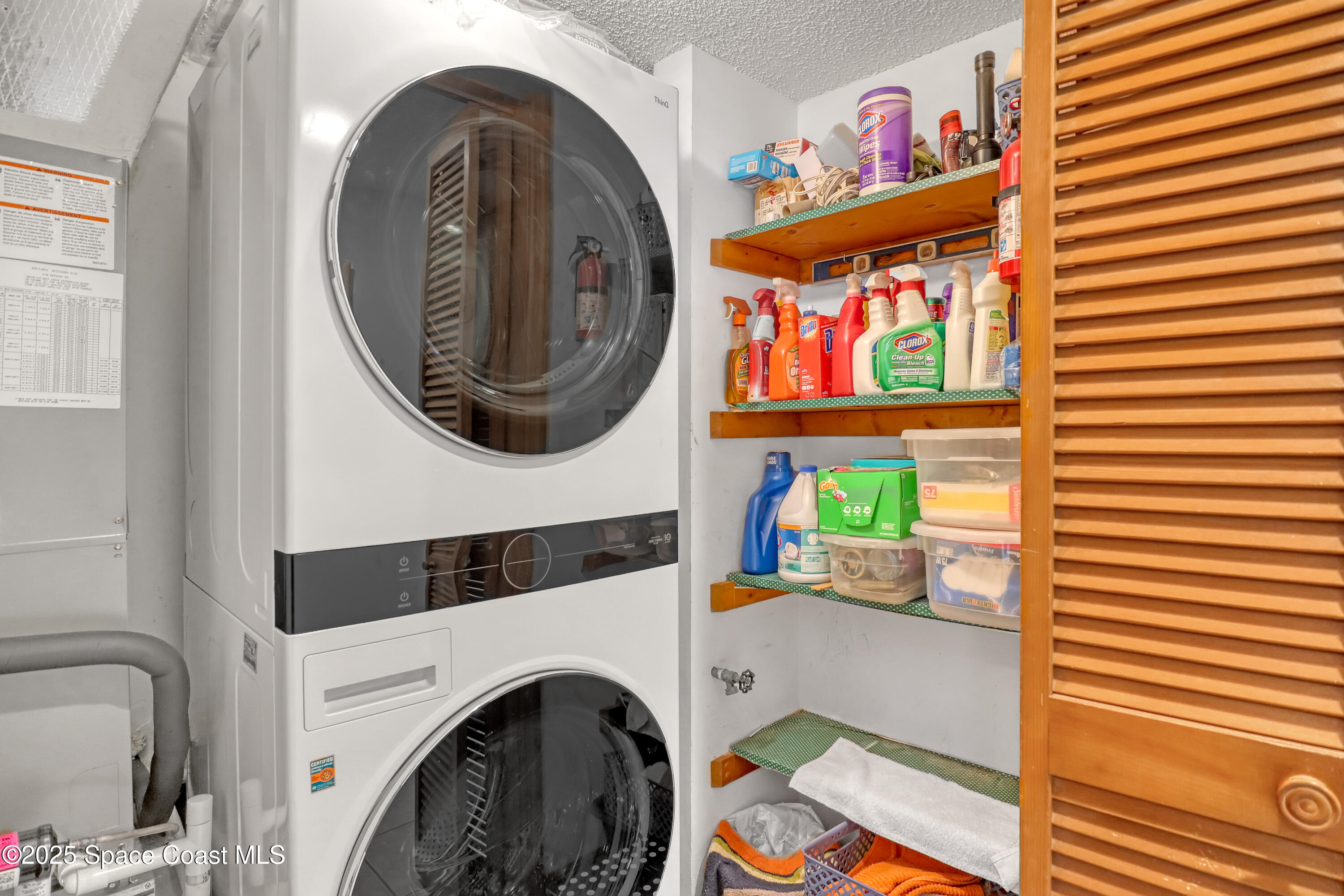 5011 Dixie Highway Northeast, Unit A209 Palm Bay, FL 32905 - Photo 23 of 44 a utility room with dryer and washer