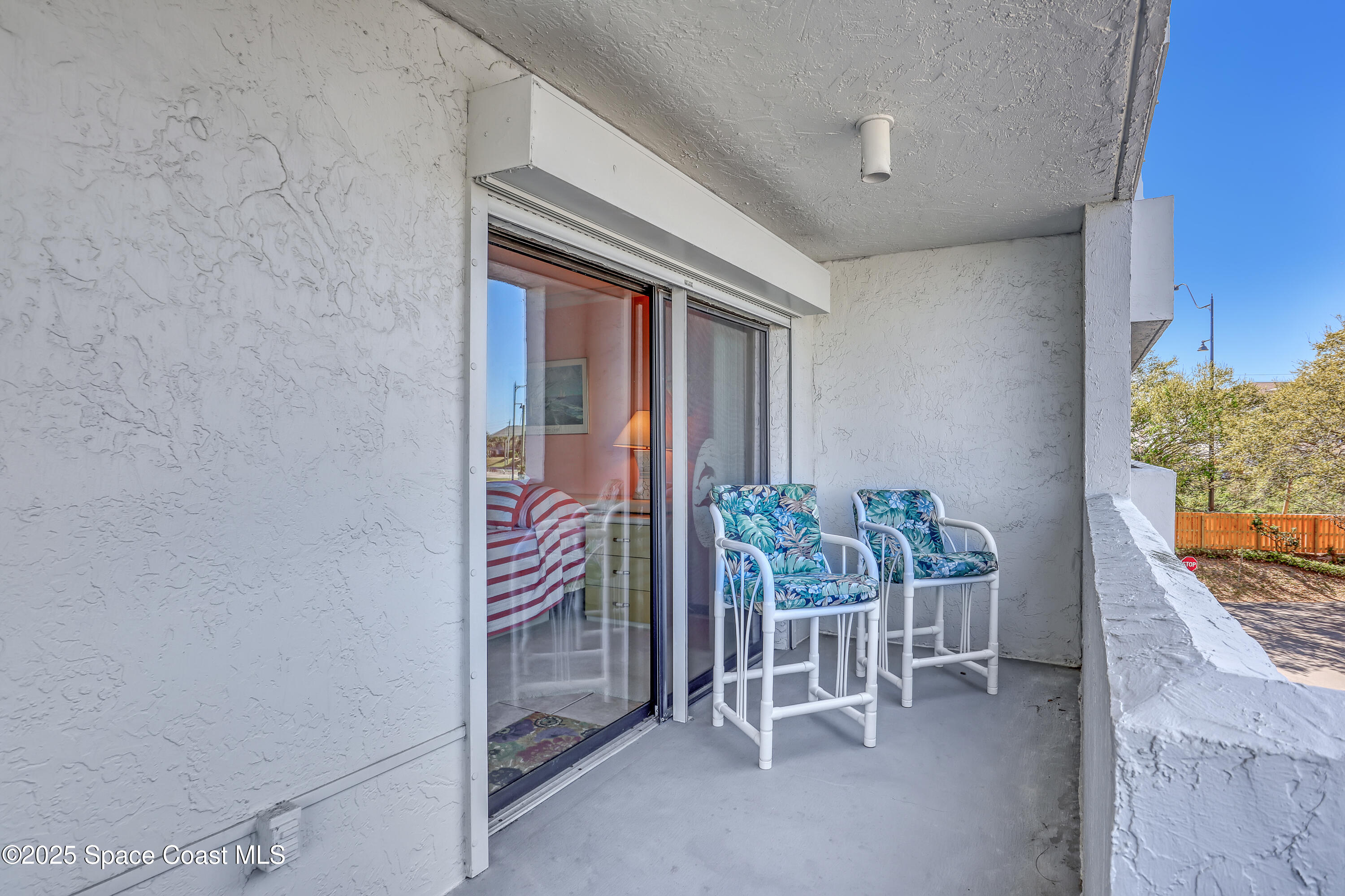 5011 Dixie Highway Northeast, Unit A209 Palm Bay, FL 32905 - Photo 25 of 44 a balcony with chairs and with table