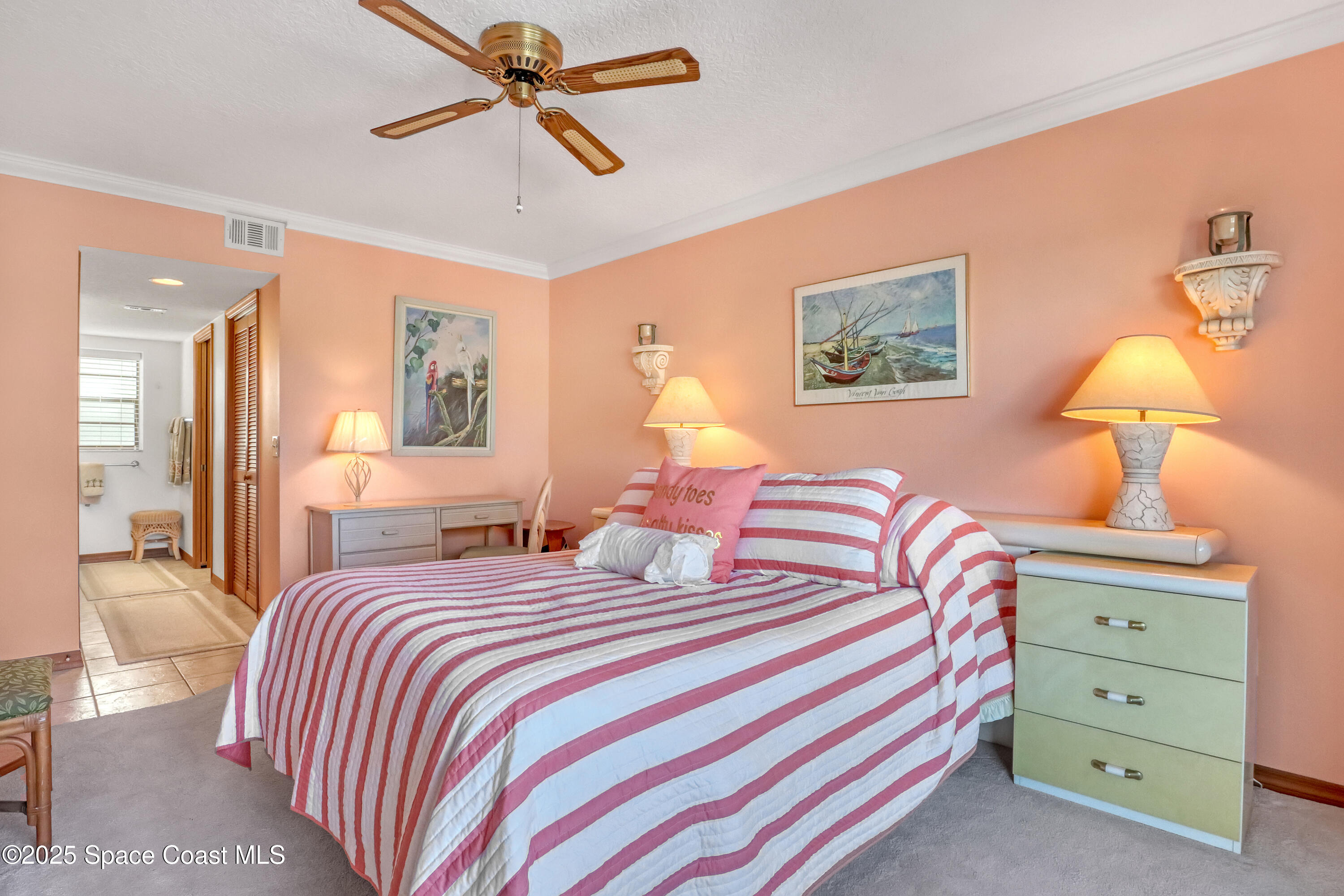 5011 Dixie Highway Northeast, Unit A209 Palm Bay, FL 32905 - Photo 29 of 44 a bedroom with a bed and a chandelier