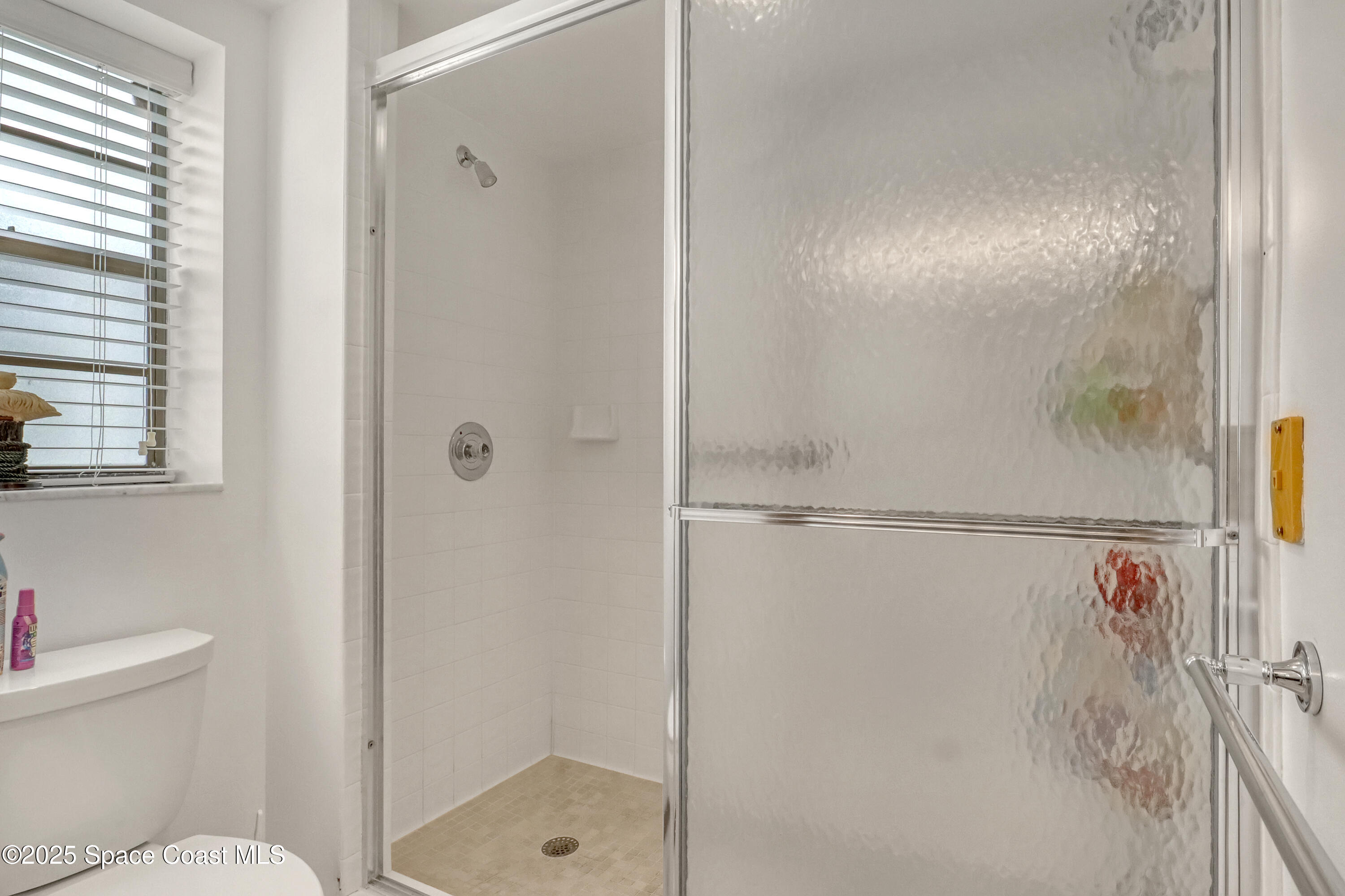 5011 Dixie Highway Northeast, Unit A209 Palm Bay, FL 32905 - Photo 31 of 44 a bathroom with a shower and a toilet