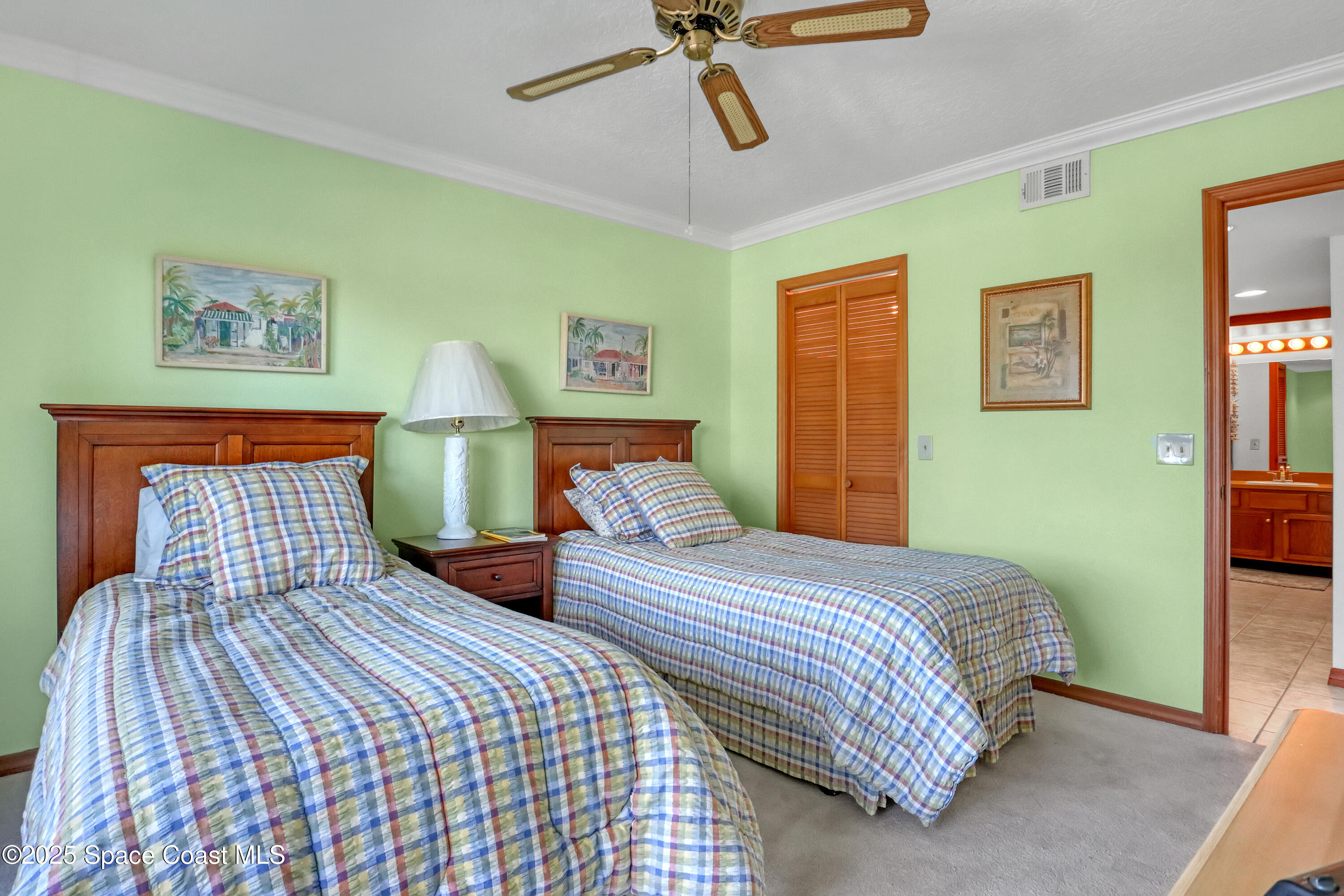 5011 Dixie Highway Northeast, Unit A209 Palm Bay, FL 32905 - Photo 35 of 44 a bedroom with beds and cupboard