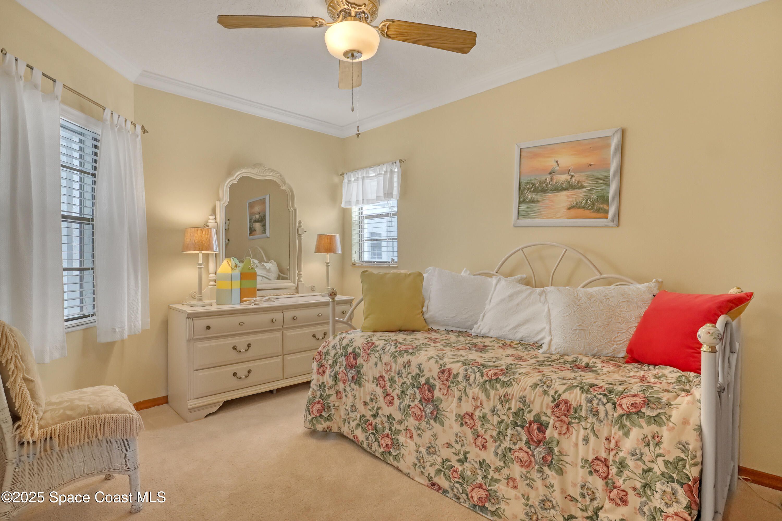5011 Dixie Highway Northeast, Unit A209 Palm Bay, FL 32905 - Photo 37 of 44 a bedroom with a bed and a chandelier