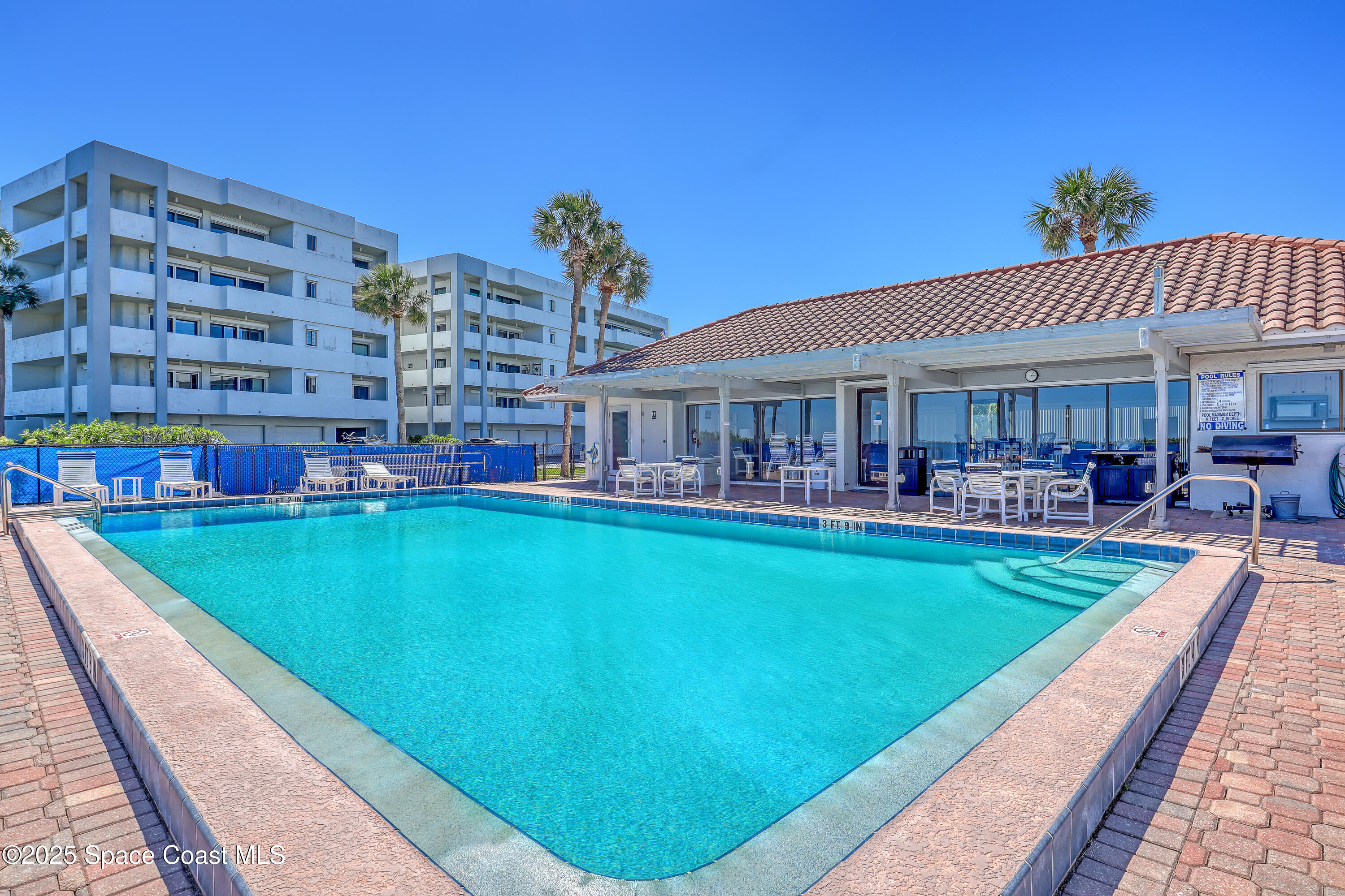 5011 Dixie Highway Northeast, Unit A209 Palm Bay, FL 32905 - Photo 39 of 44 a view of a swimming pool with outdoor seating
