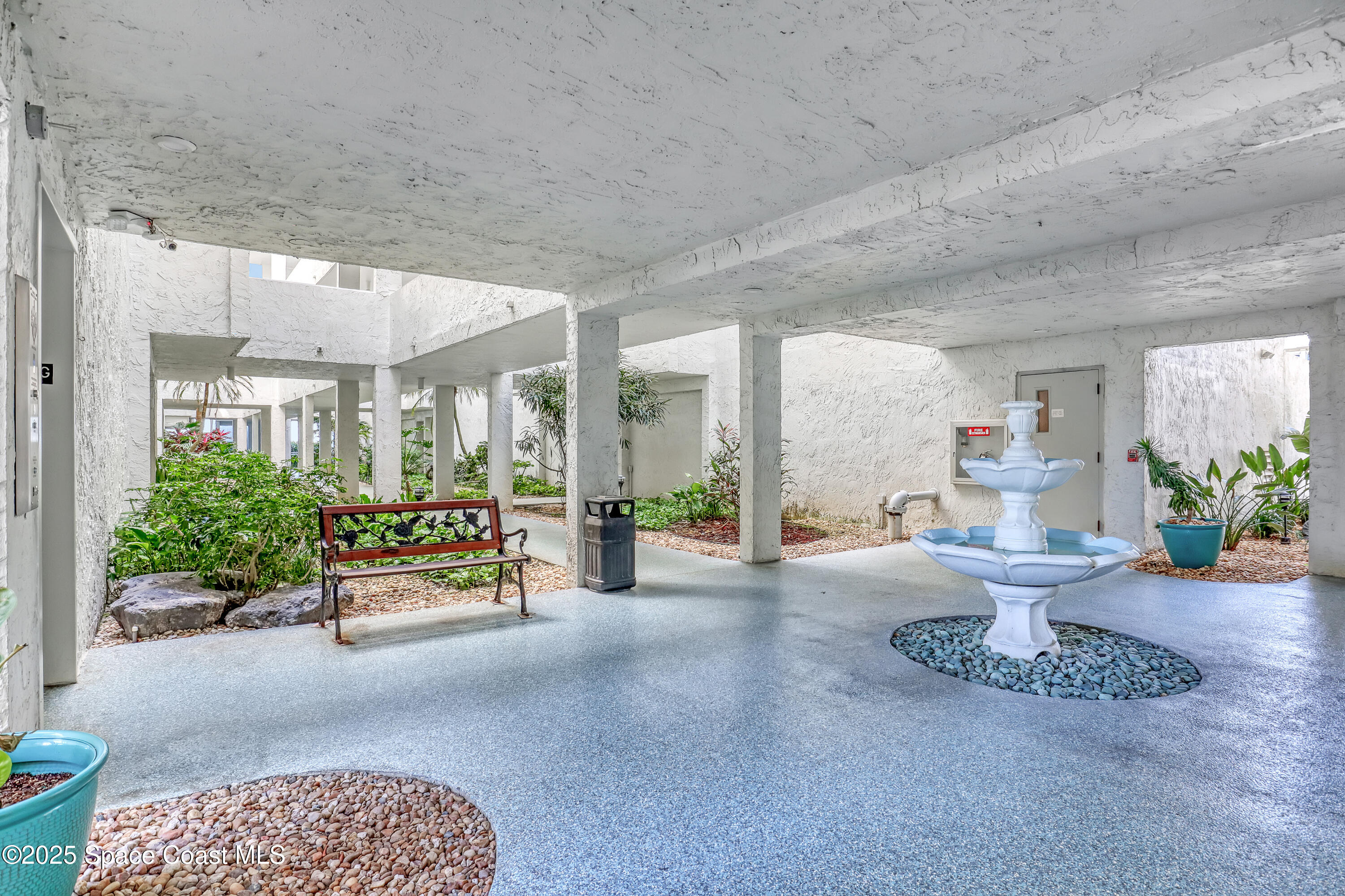 5011 Dixie Highway Northeast, Unit A209 Palm Bay, FL 32905 - Photo 7 of 44 a lobby with furniture and potted plants