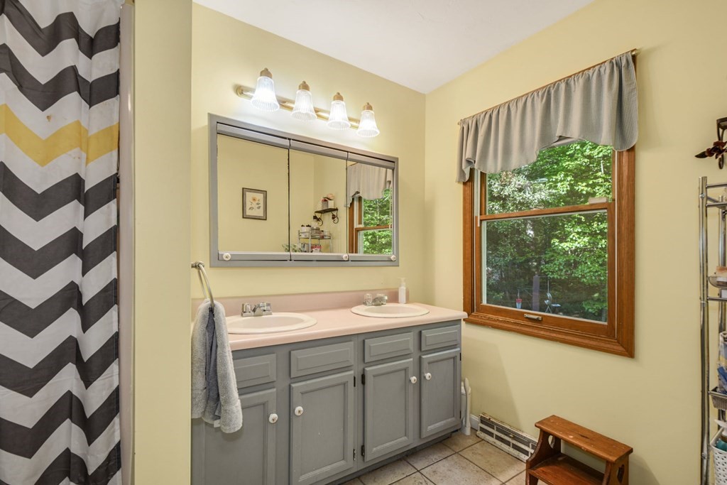 2020 Bay Road Stoughton, MA 02072 - Photo 21 of 38 a bathroom with a sink and a mirror
