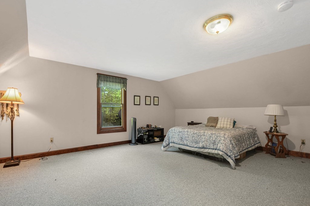 2020 Bay Road Stoughton, MA 02072 - Photo 25 of 38 a room with a bed and a chair