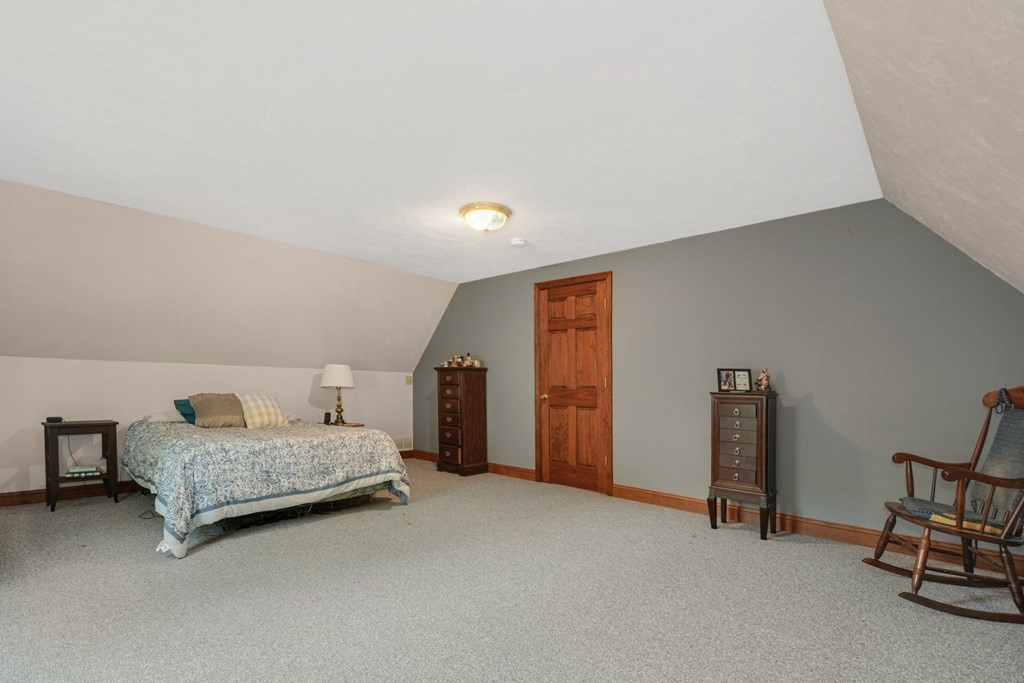 2020 Bay Road Stoughton, MA 02072 - Photo 27 of 38 a living room with furniture and a lamp