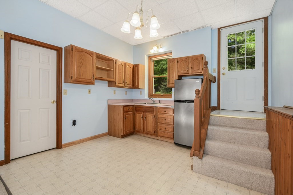 2020 Bay Road Stoughton, MA 02072 - Photo 31 of 38 a kitchen with stainless steel appliances granite countertop a refrigerator and a stove top oven