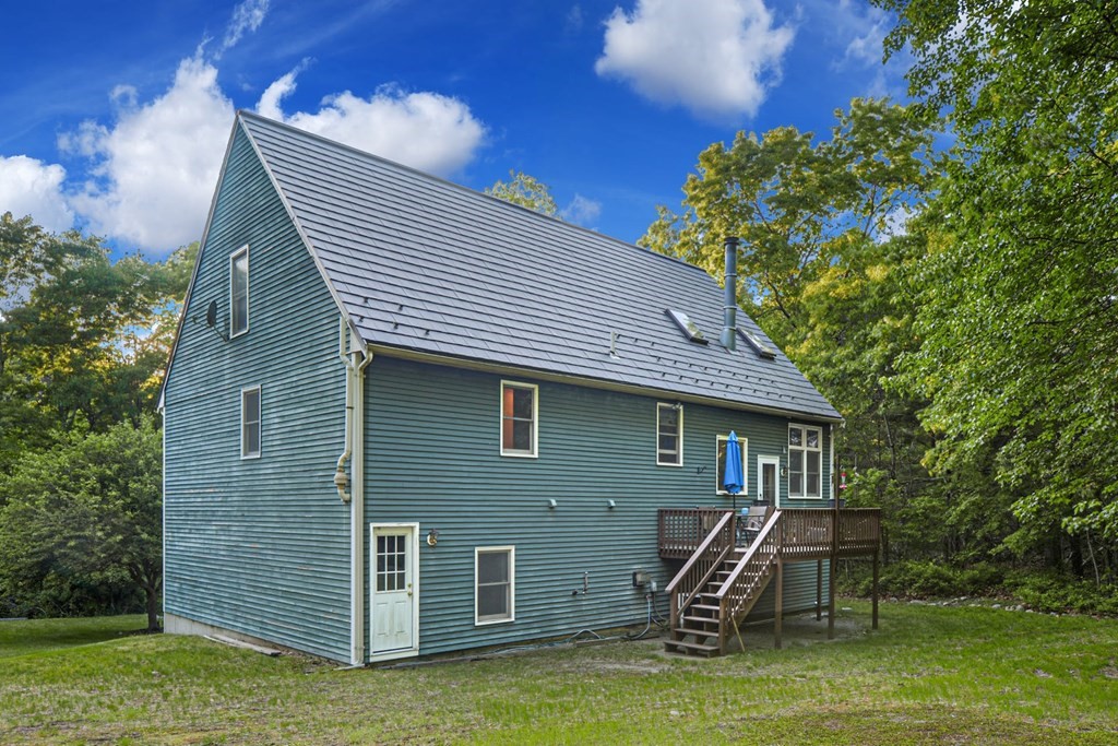2020 Bay Road Stoughton, MA 02072 - Photo 37 of 38 a front view of a house with a yard