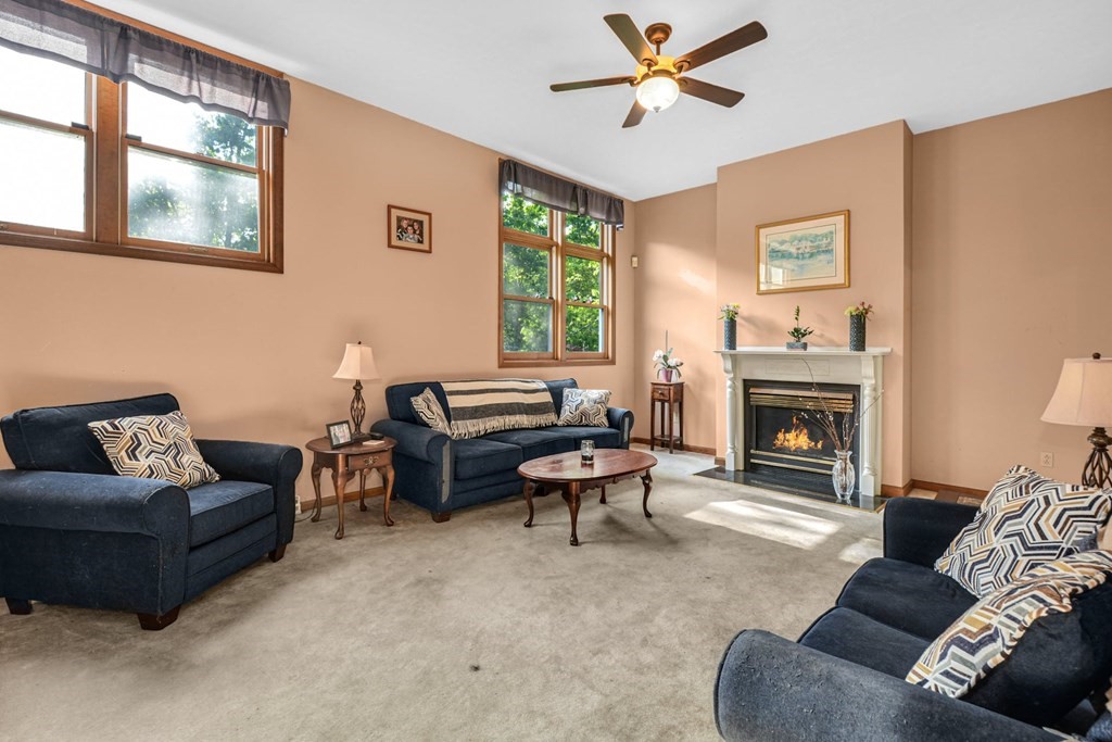 2020 Bay Road Stoughton, MA 02072 - Photo 6 of 38 a living room with furniture and a fireplace