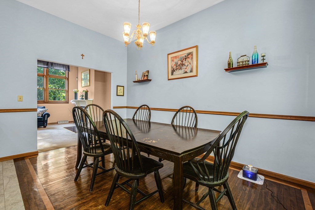 2020 Bay Road Stoughton, MA 02072 - Photo 10 of 38 a view of a dining room with furniture a chandelier and wooden floor