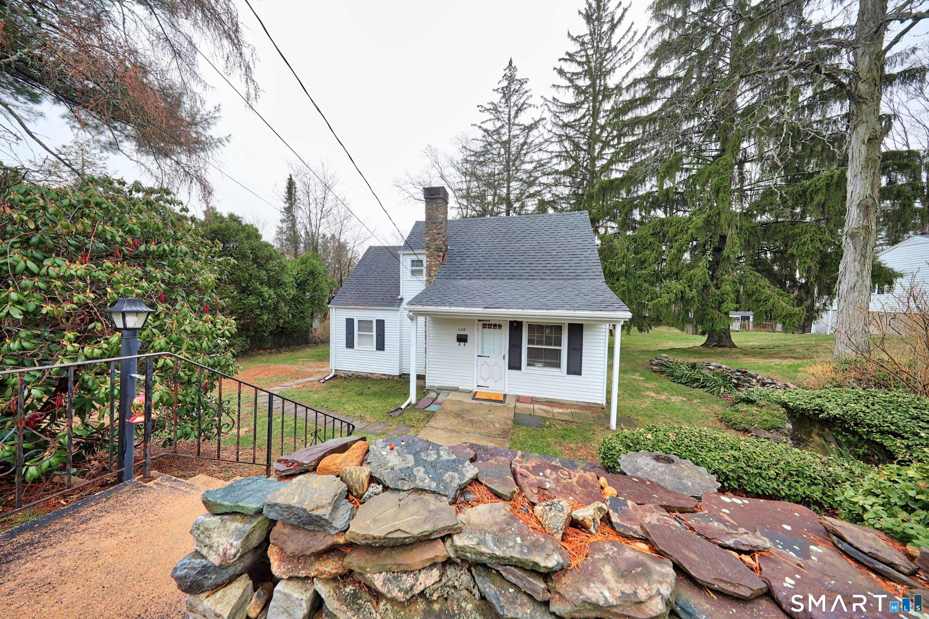 125 Tioga Street Torrington, CT 06790 - Photo 1 of 40 a view of a house with a patio