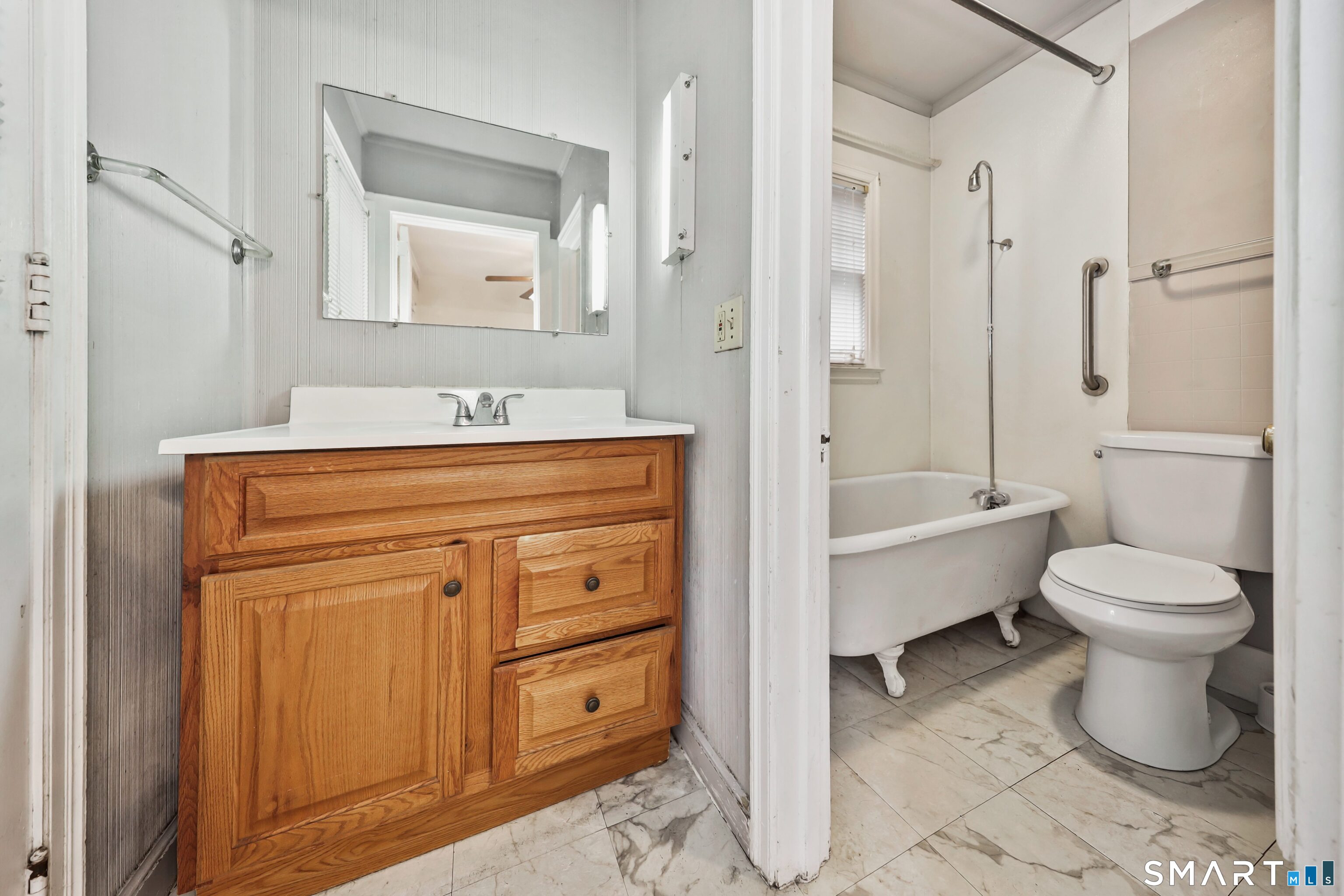 125 Tioga Street Torrington, CT 06790 - Photo 15 of 40 a bathroom with a sink a toilet and shower