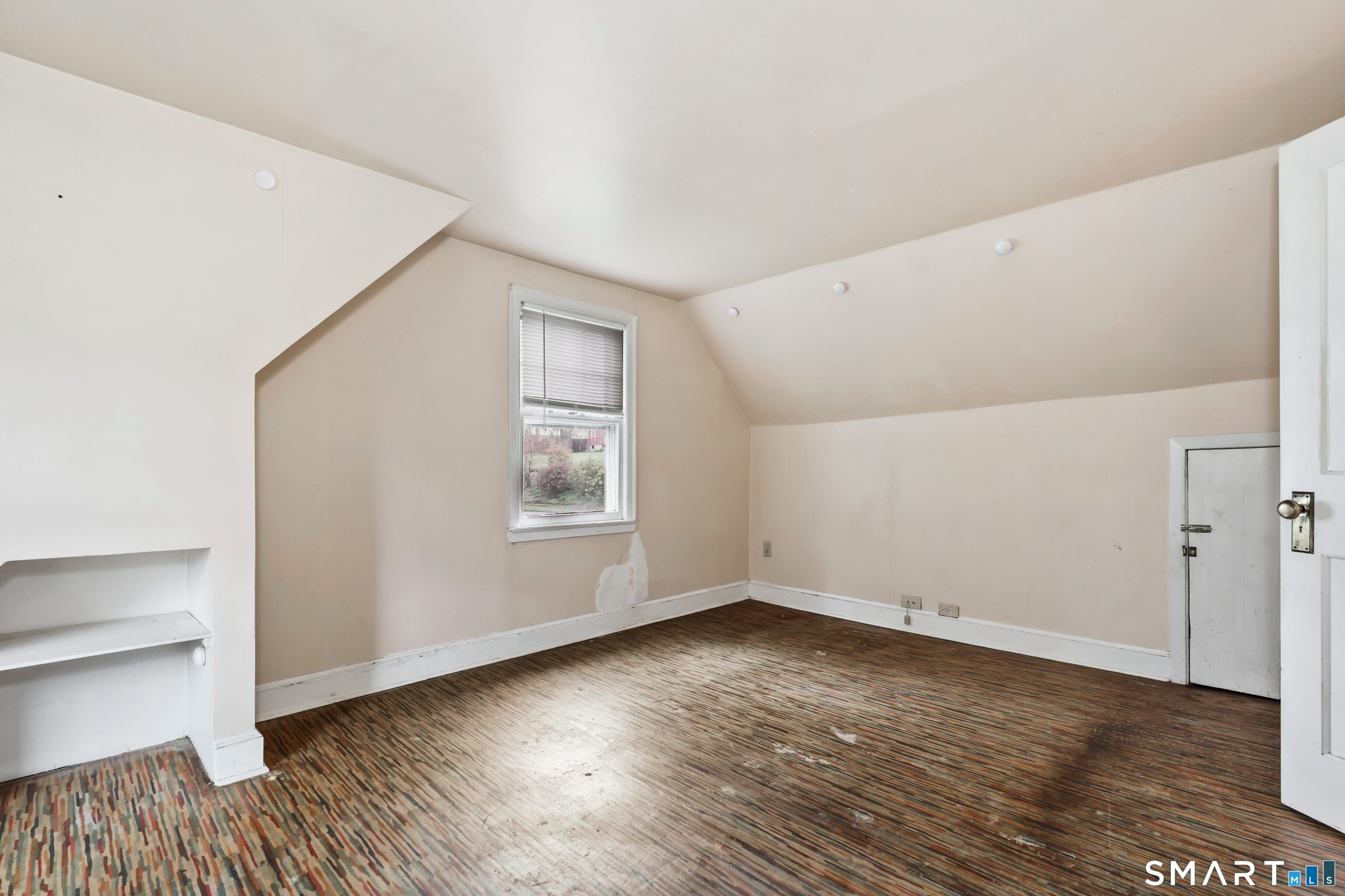 125 Tioga Street Torrington, CT 06790 - Photo 20 of 40 a view of empty room with wooden floor and fan