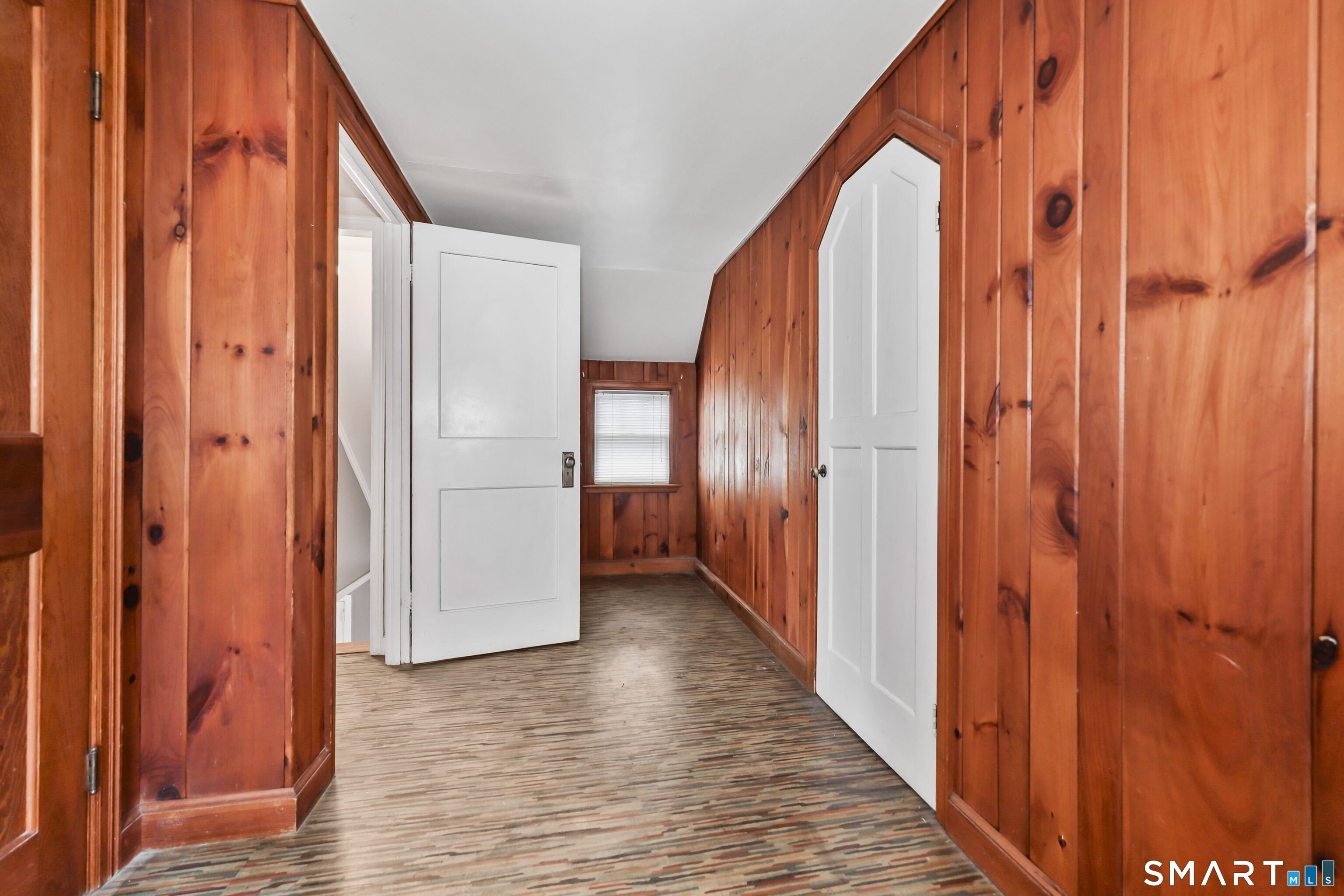 125 Tioga Street Torrington, CT 06790 - Photo 24 of 40 a view of a hallway with wooden floor and staircase