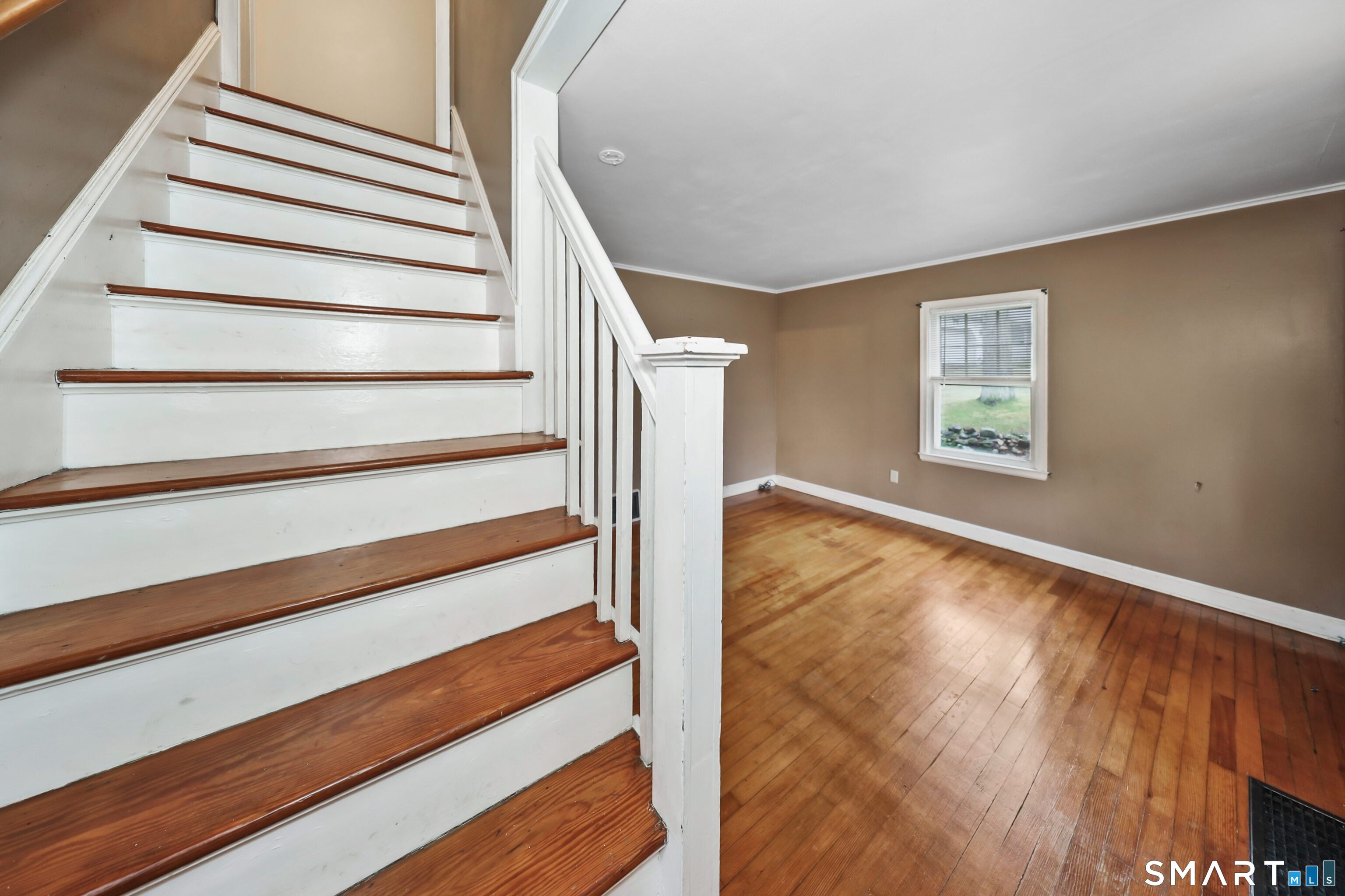 125 Tioga Street Torrington, CT 06790 - Photo 28 of 40 a view of entryway with wooden floor and stairs