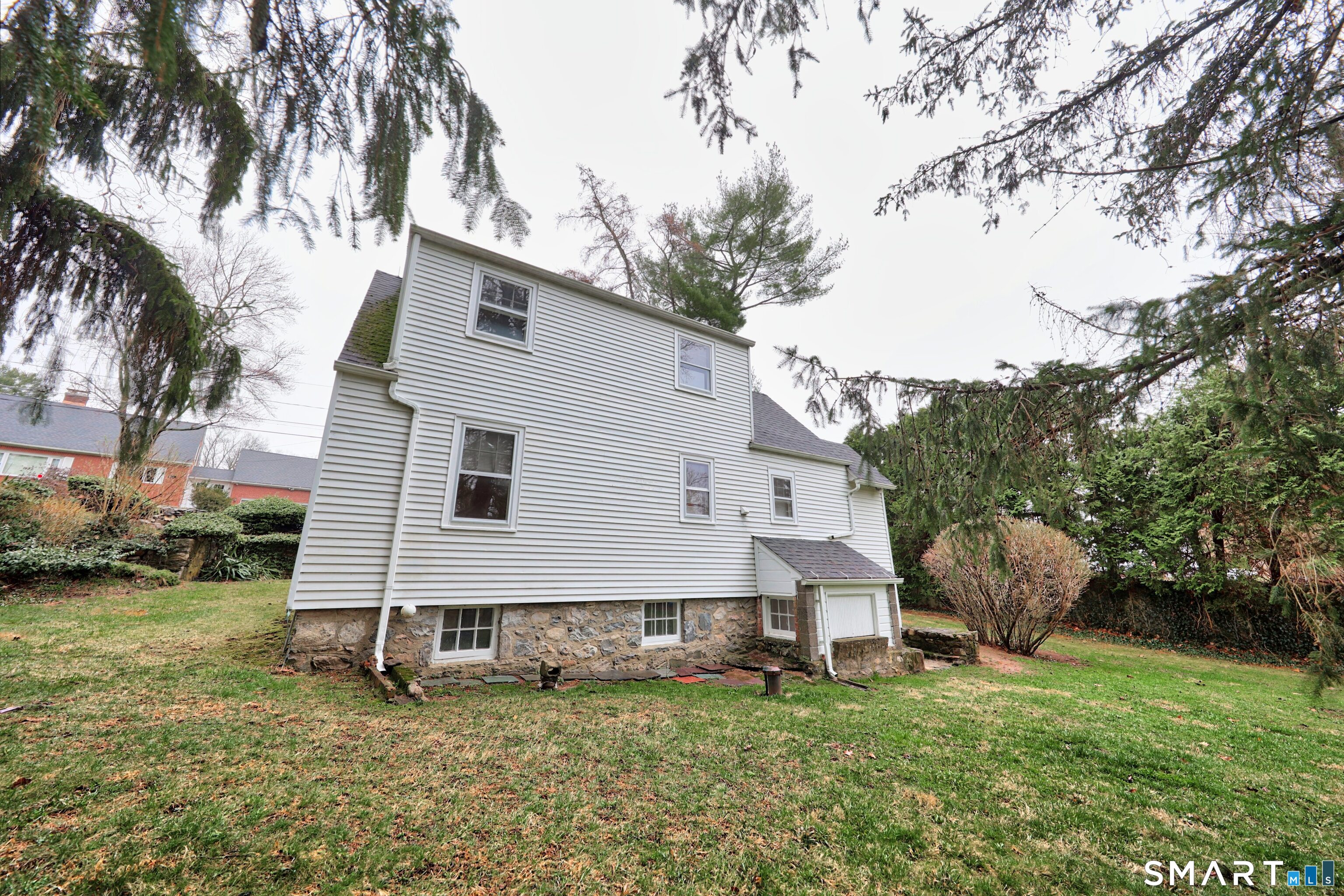 125 Tioga Street Torrington, CT 06790 - Photo 29 of 40 a view of a house with a yard