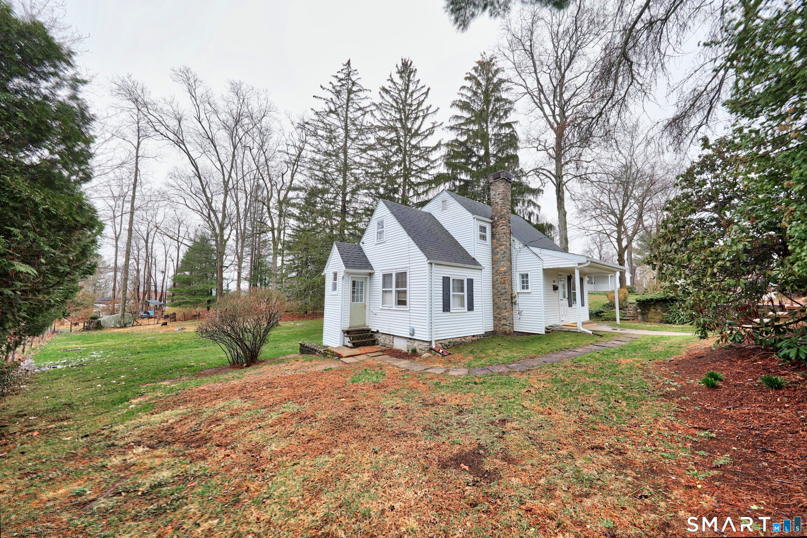 125 Tioga Street Torrington, CT 06790 - Photo 31 of 40 a house with a large tree in front of it