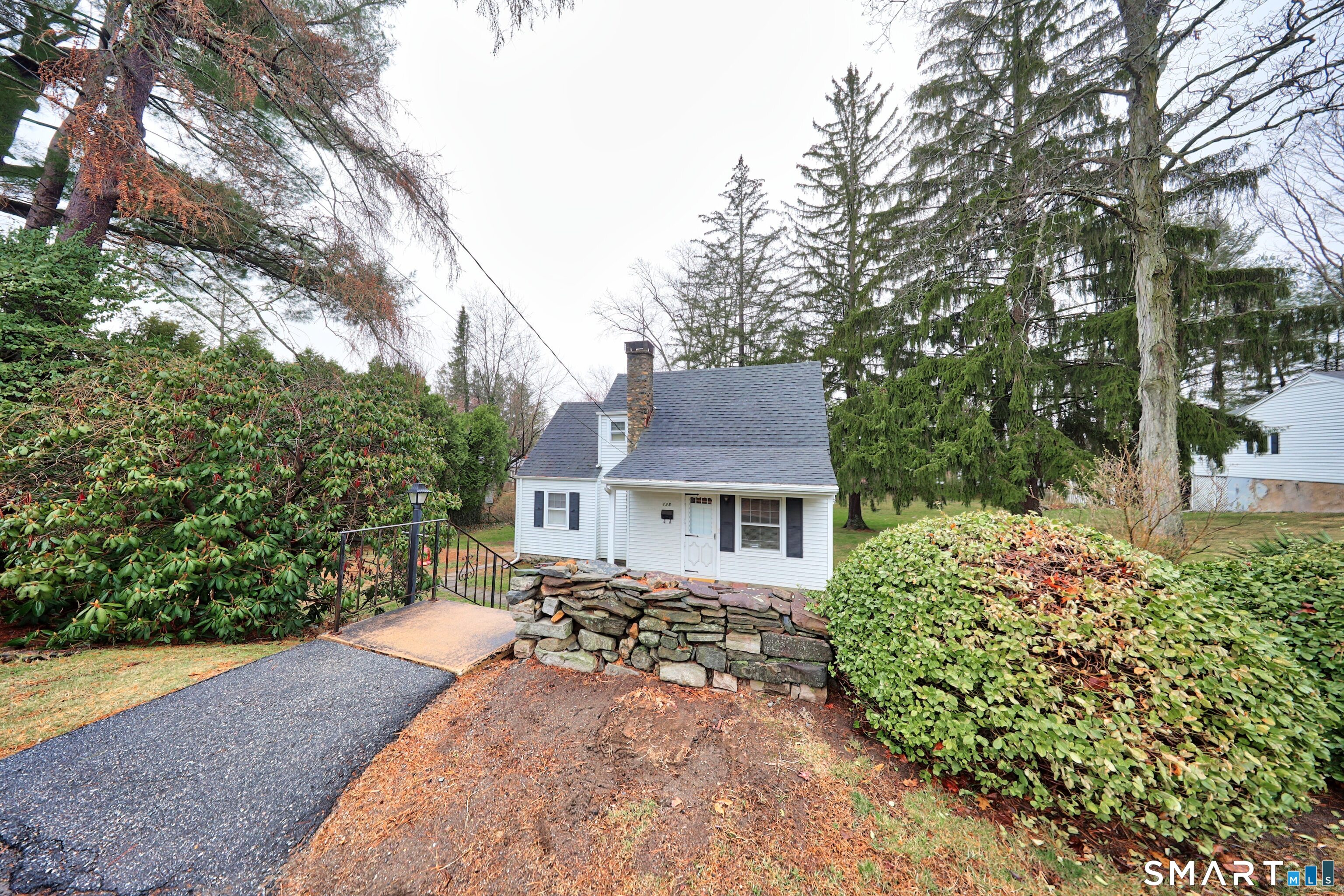 125 Tioga Street Torrington, CT 06790 - Photo 34 of 40 front view of a house with a yard