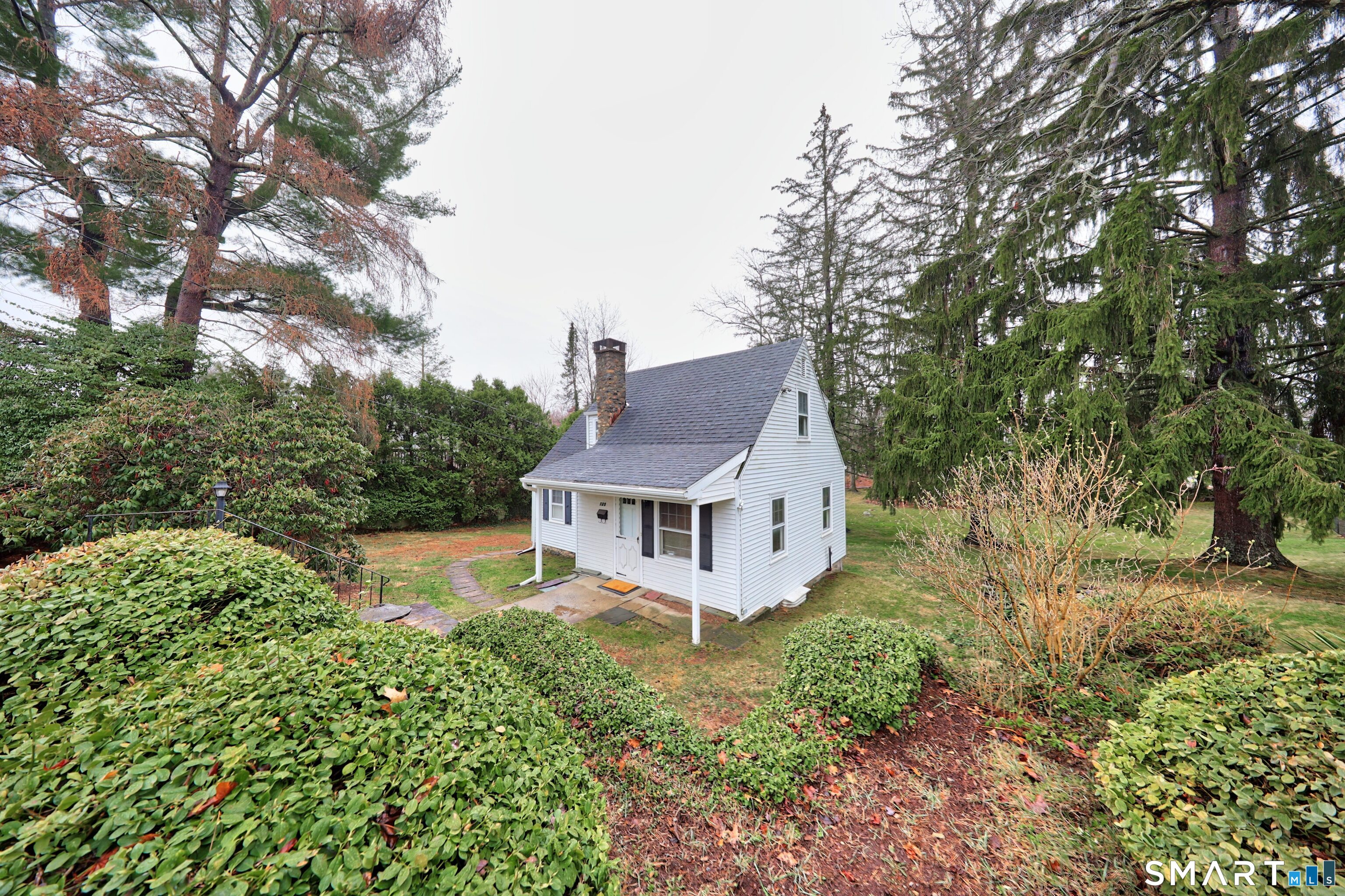 125 Tioga Street Torrington, CT 06790 - Photo 35 of 40 a aerial view of a house with a yard table and chairs