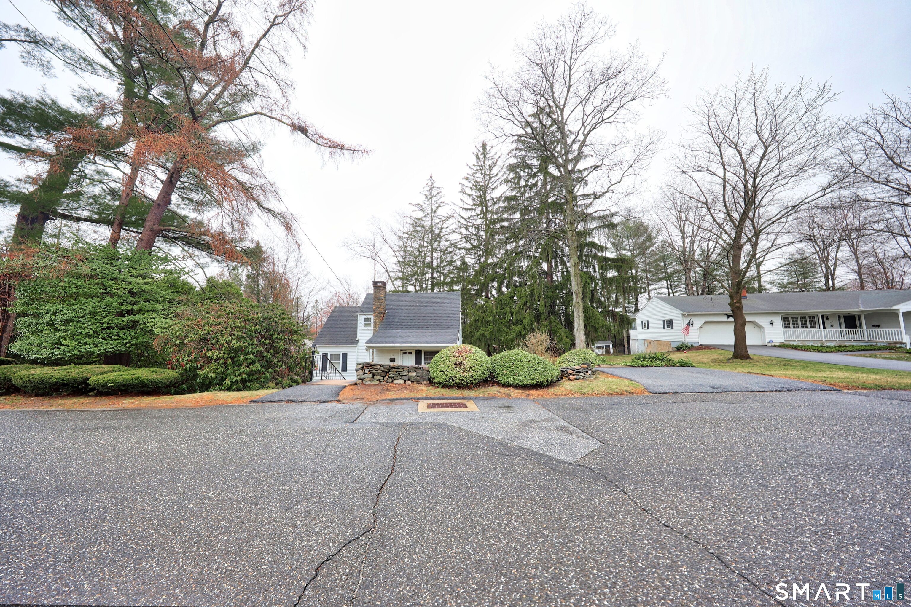 125 Tioga Street Torrington, CT 06790 - Photo 37 of 40 a view of a house with a yard and large trees