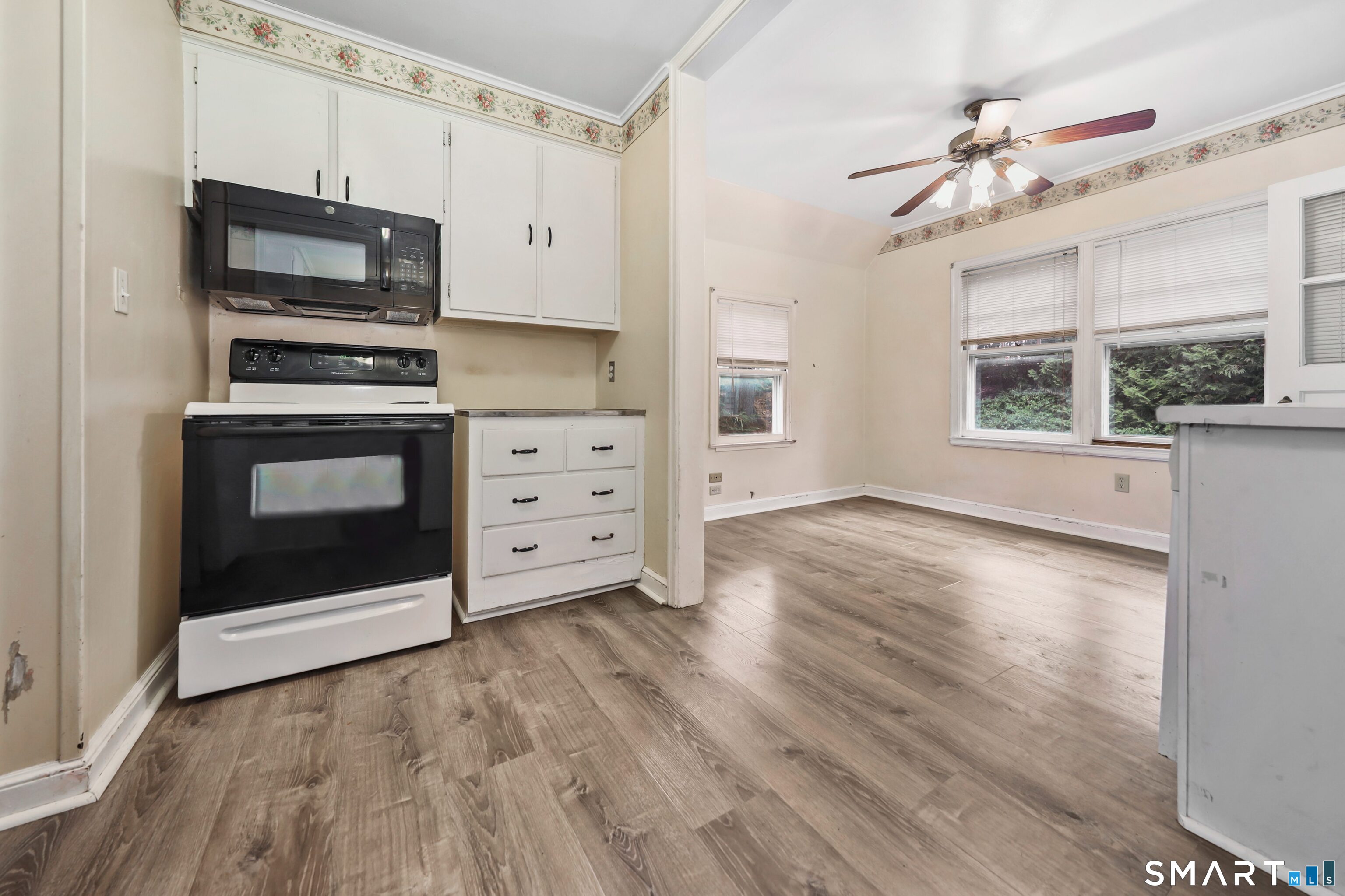 125 Tioga Street Torrington, CT 06790 - Photo 10 of 40 a kitchen with stainless steel appliances a stove top oven and a refrigerator