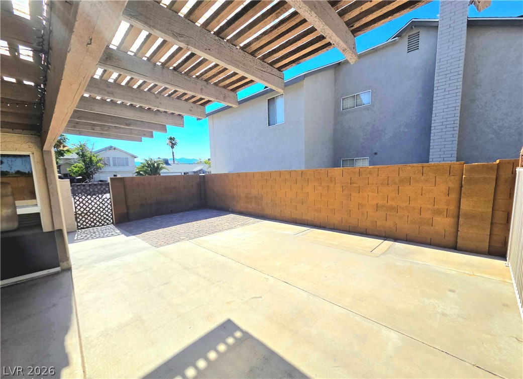 3648 Bronco Road Las Vegas, NV 89103 - Photo 15 of 24 A spacious, enclosed patio offers private outdoor living with a decorative metal gate.