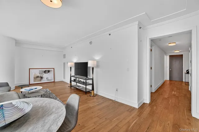 a bedroom with furniture and a wooden floor