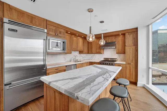 a kitchen with a table and chairs