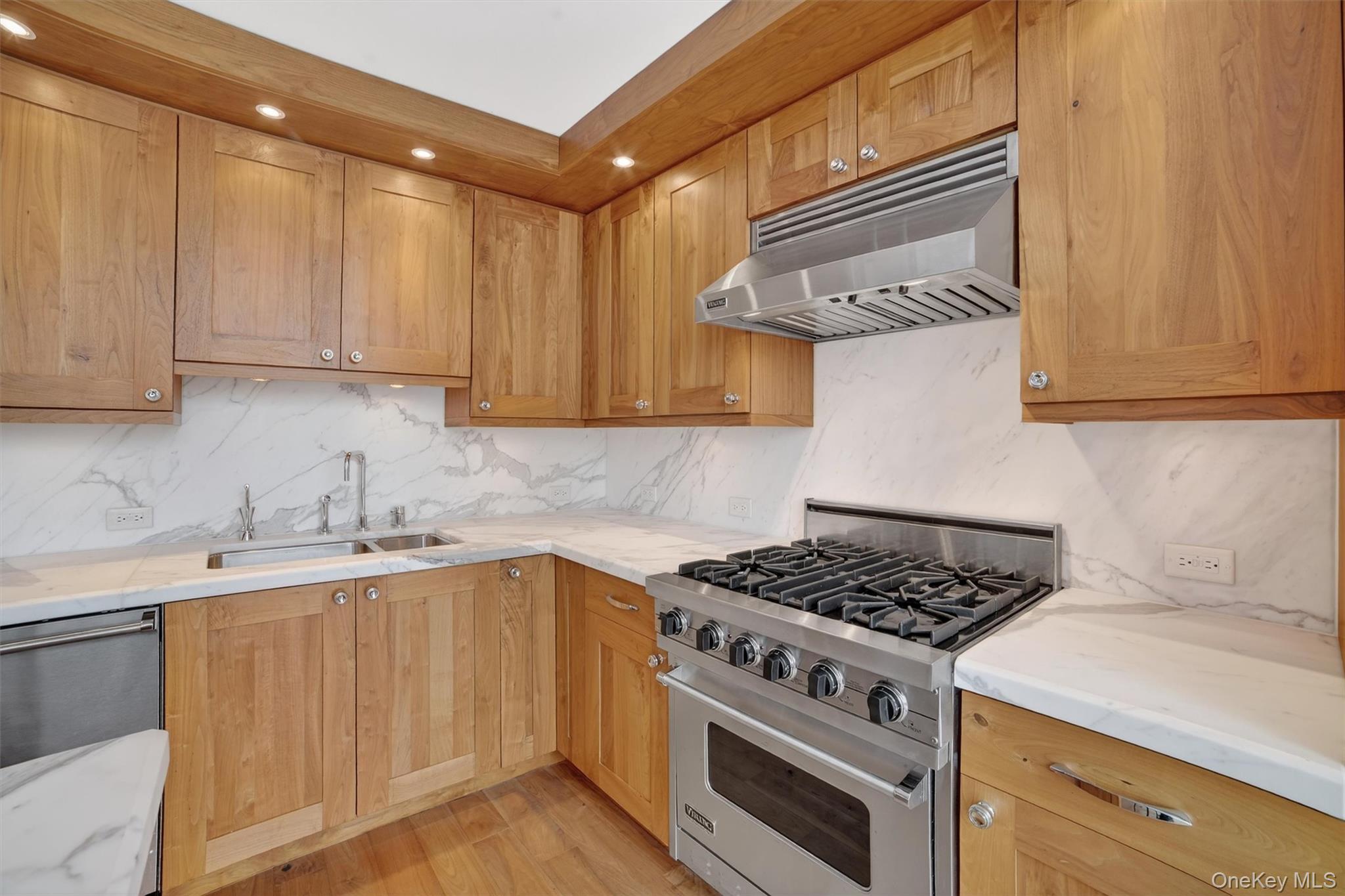 5 Renaissance Square, Unit 10G White Plains, NY 10601 - Photo 15 of 27 a kitchen with stainless steel appliances granite countertop a sink stove and cabinets