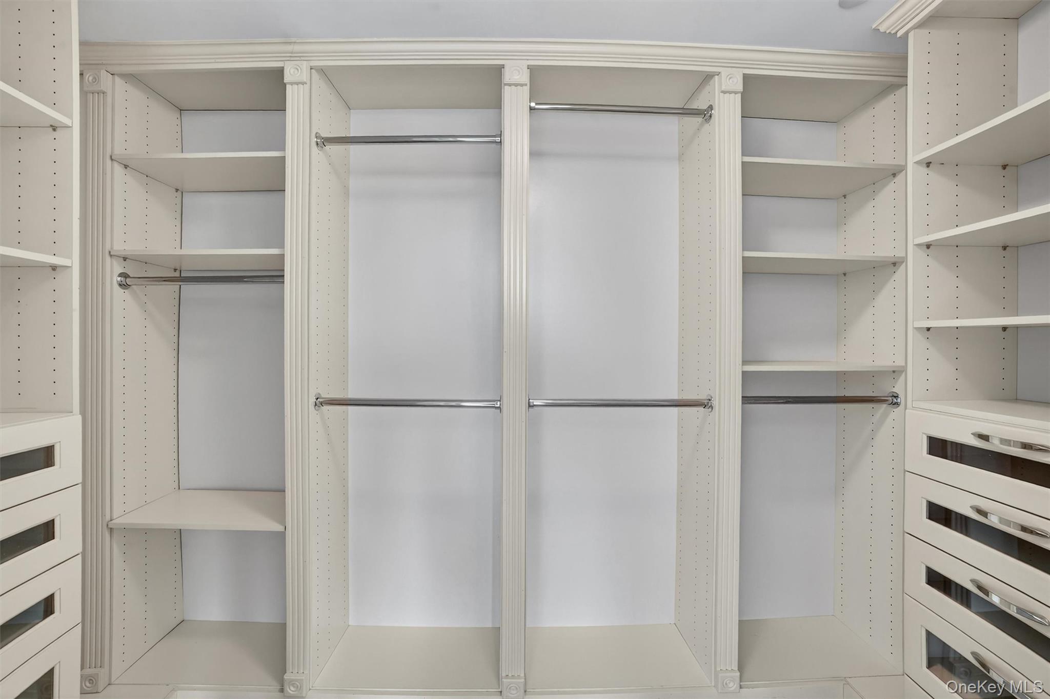 5 Renaissance Square, Unit 10G White Plains, NY 10601 - Photo 21 of 27 a view of walk in closet with empty racks