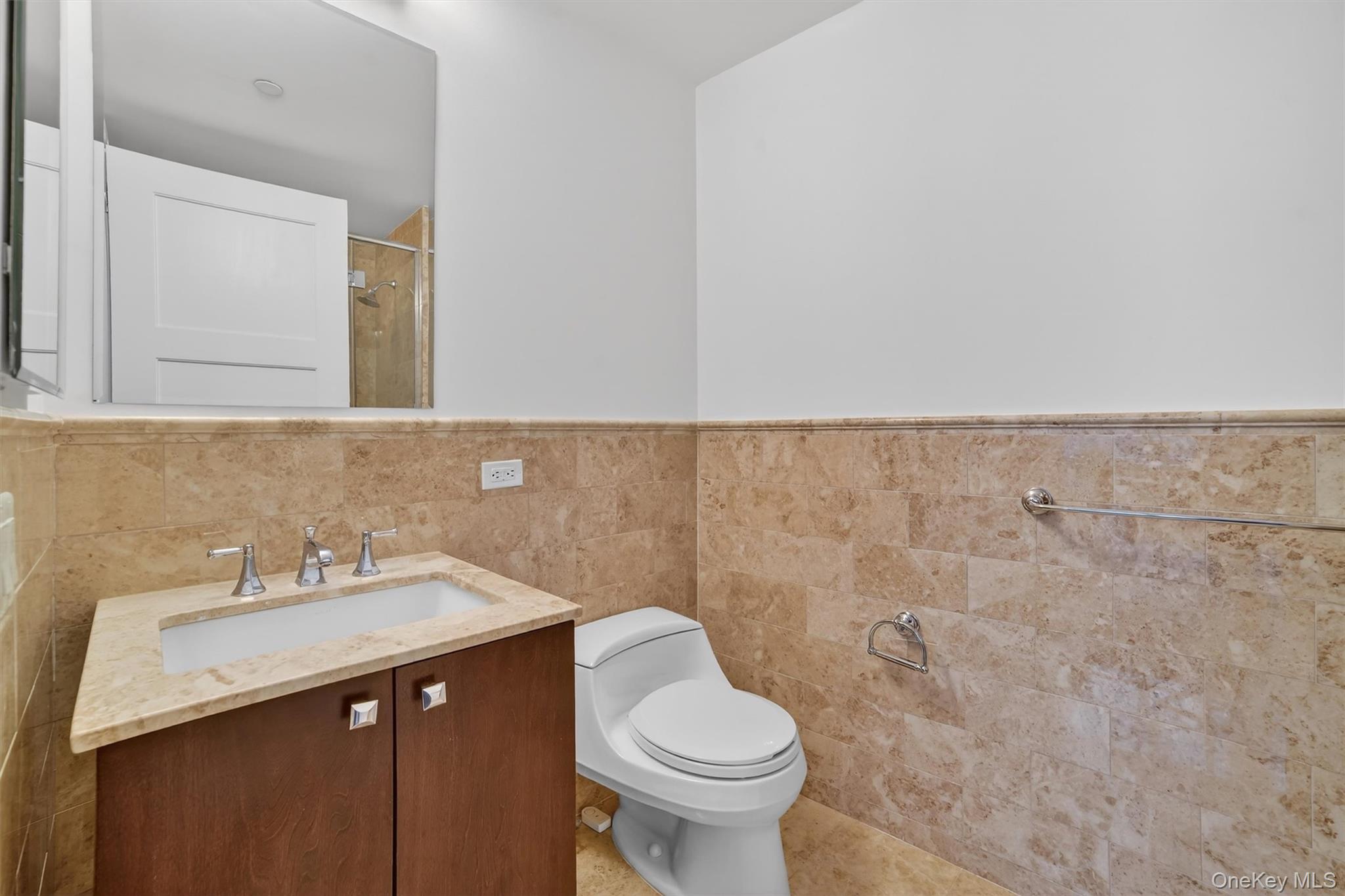 5 Renaissance Square, Unit 10G White Plains, NY 10601 - Photo 26 of 27 a bathroom with a sink and a toilet