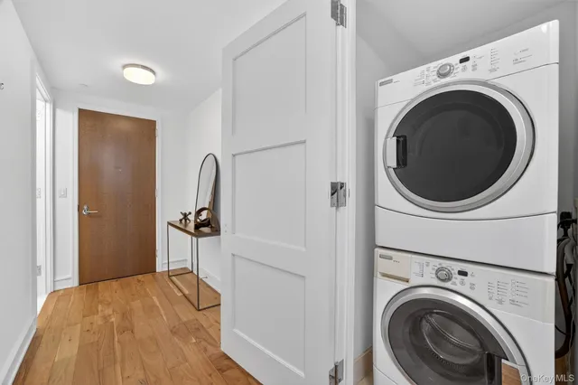 a view of a bedroom with washer and dryer