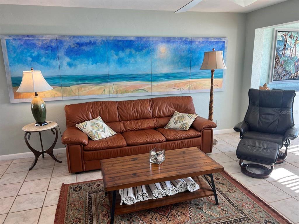 6006 Midnight Pass Road, Unit 40 Sarasota, FL 34242 - Photo 3 of 25 a living room with furniture and a couch