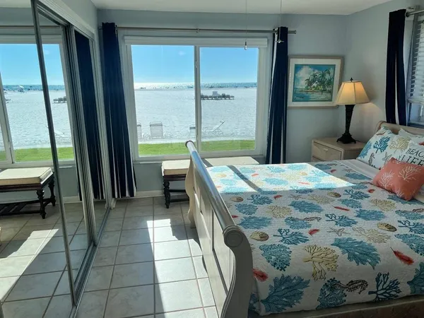 a white toilet sitting next to a bath tub