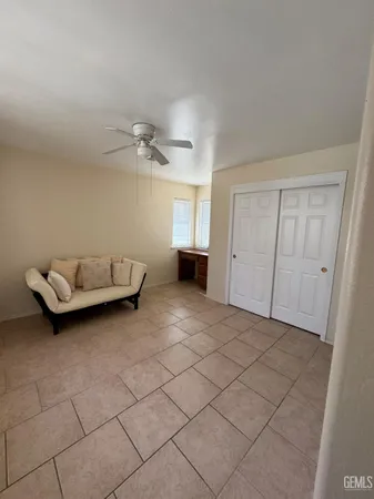 a bedroom with bed and window