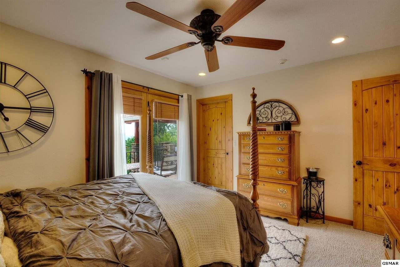 796 Deer Ridge Drive Rutledge, TN 37861 - Photo 18 of 35 a bedroom with bed and a mirror
