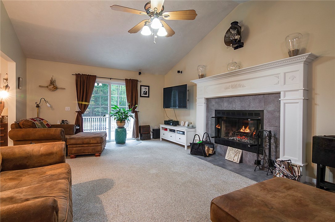 1883 Snake Hill Road Glocester, RI 02814 - Photo 4 of 18 Large working fire place in living room surrounded by a beautiful mantle.