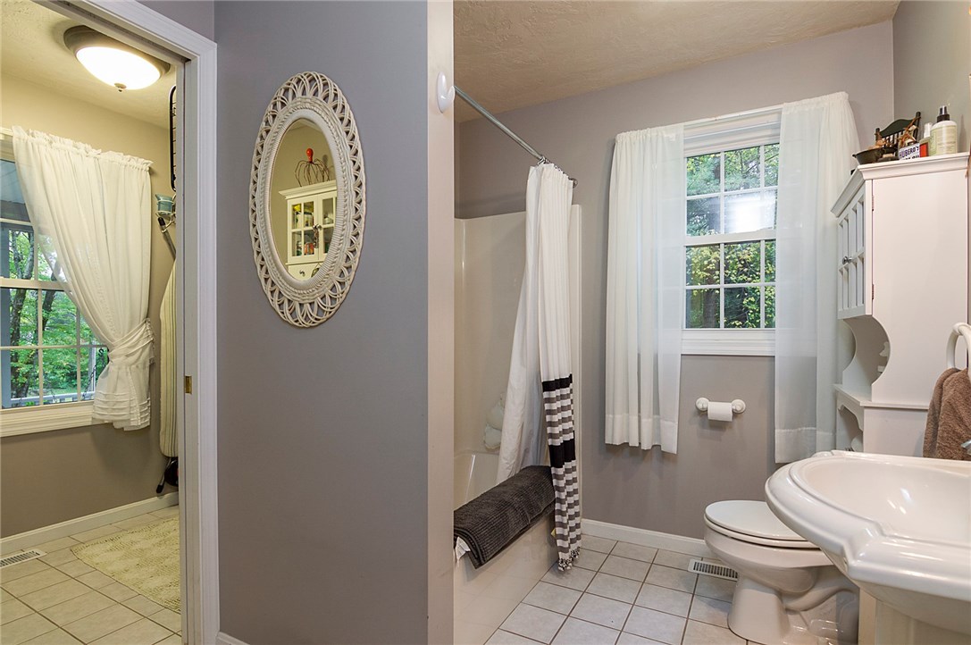 1883 Snake Hill Road Glocester, RI 02814 - Photo 9 of 18 Full bathroom on first floor features Tub, Shower & attached Laundry room.