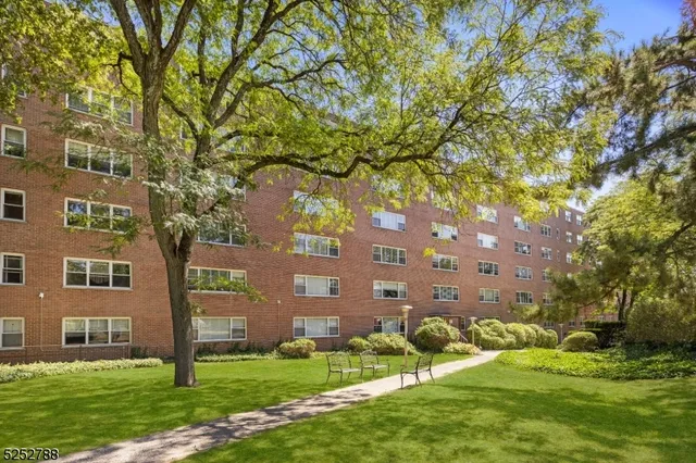 front view of a building with a yard