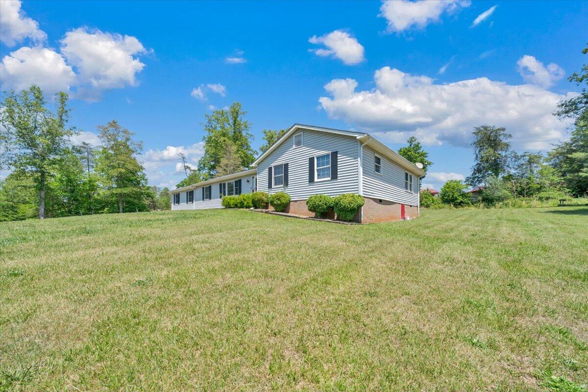 3870 Goose Dam Road Rocky Mount, VA 24151 - Photo 44 of 44 a view of a house with a big yard and large trees