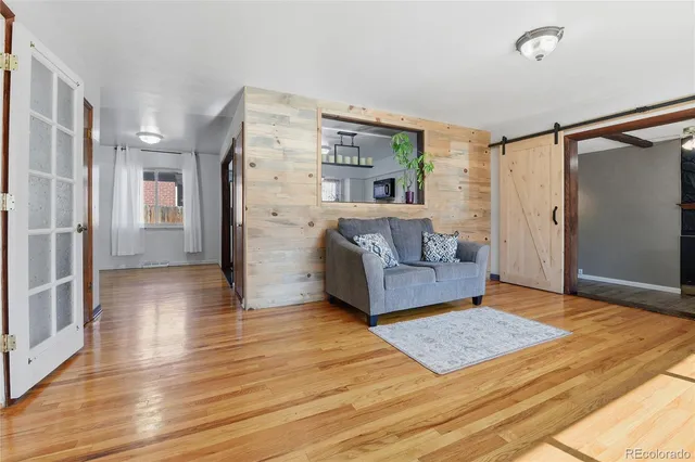 a living room with furniture and a rug