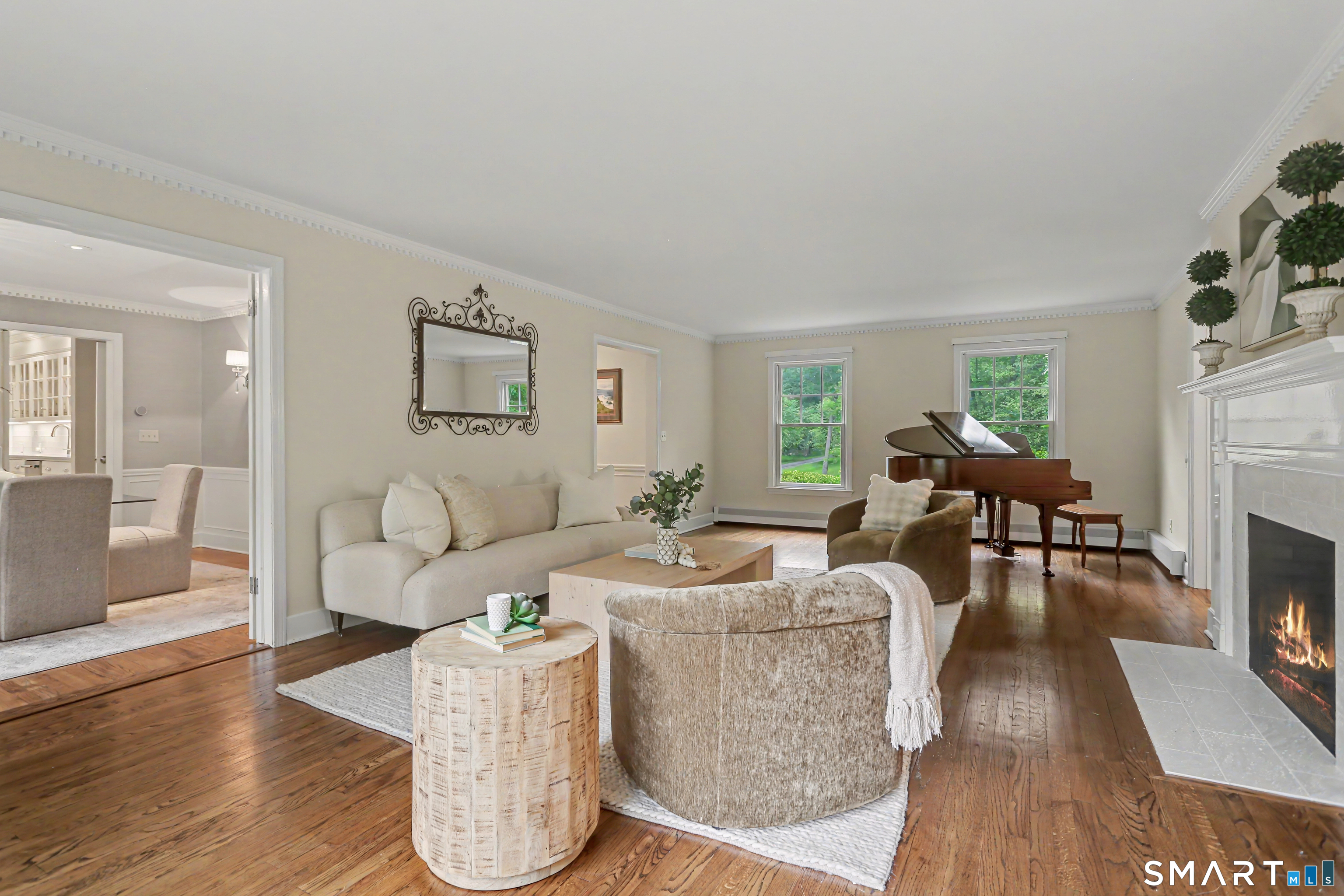 108 Logan Road New Canaan, CT 06840 - Photo 5 of 40 a living room with fireplace furniture and a wooden floor