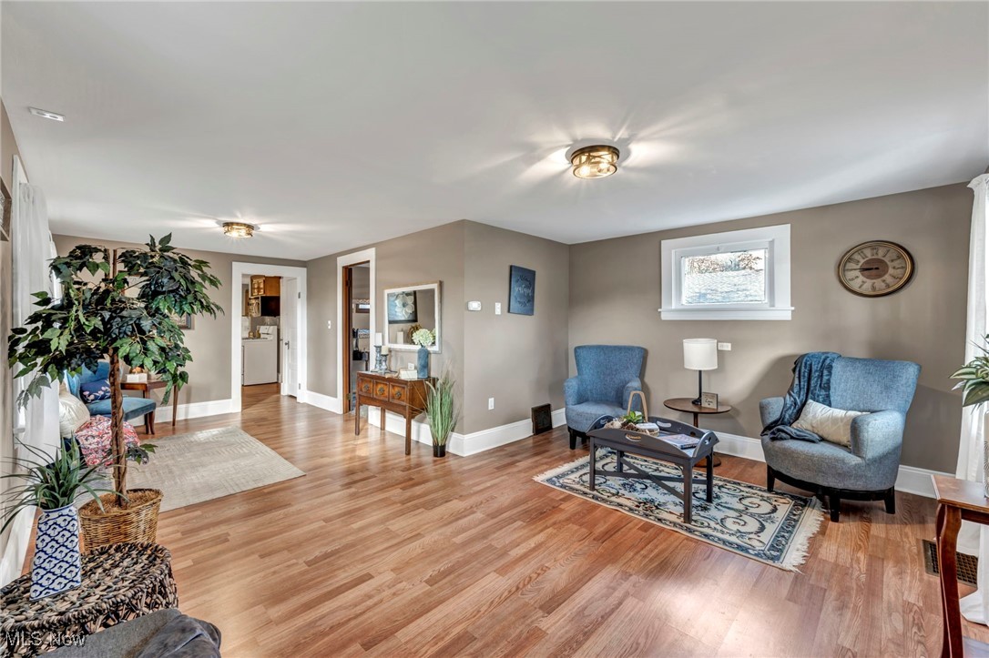 6030 Dunham Road Maple Heights, OH 44137 - Photo 10 of 50 Living area featuring wood finished floors and baseboards