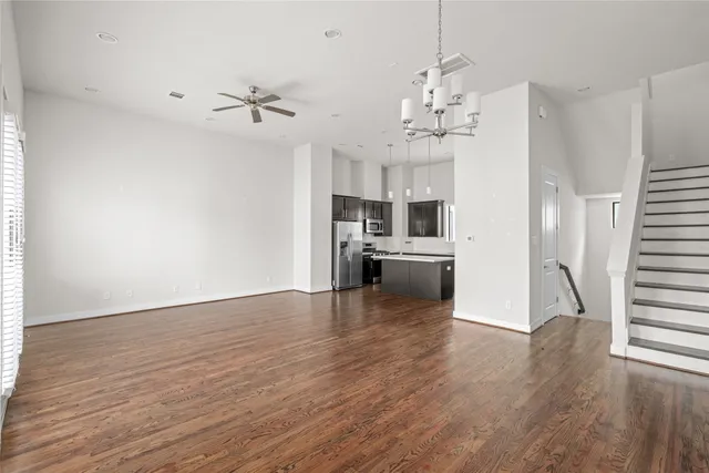 a view of a kitchen with a sink wooden floor and a kitchen