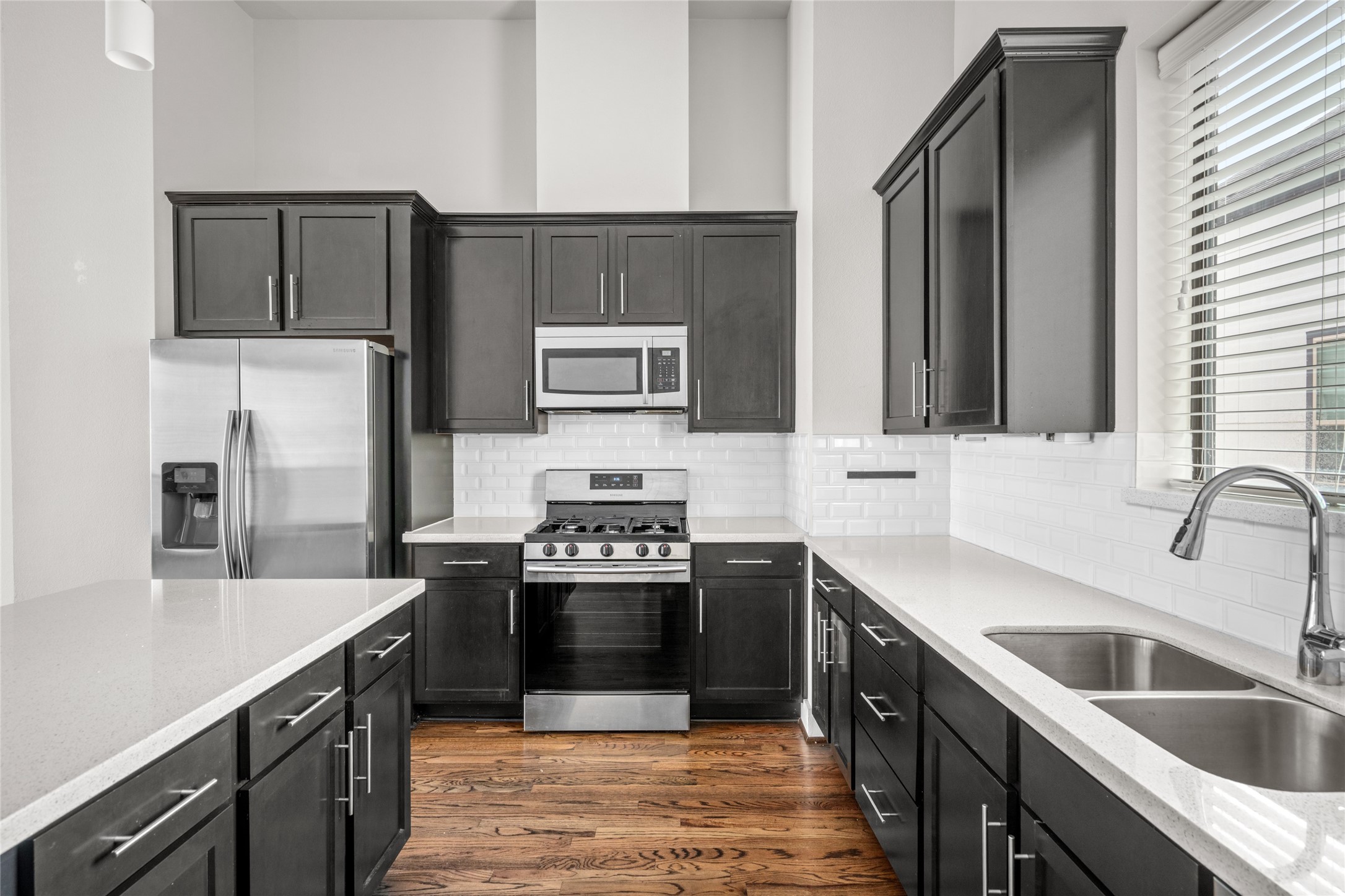 3409 Kensington Yellow Place Houston, TX 77008 - Photo 15 of 28 a kitchen with stainless steel appliances granite countertop a sink stove and refrigerator