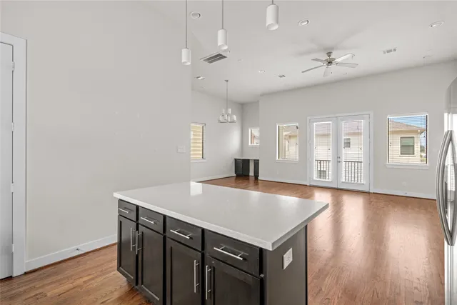 a room with pool table and windows