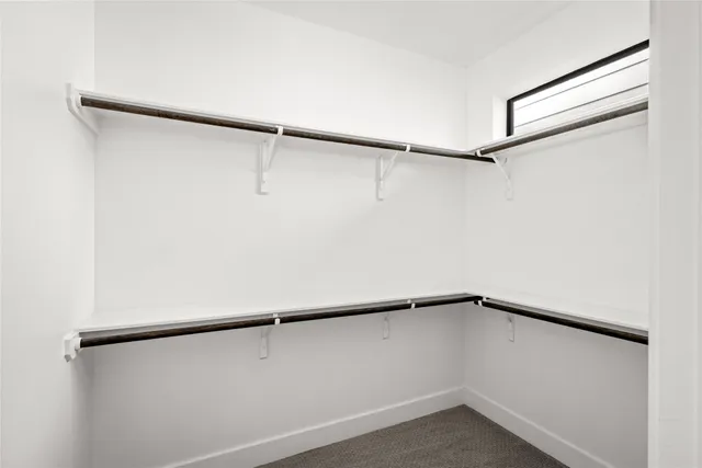 a view of an empty walk in closet