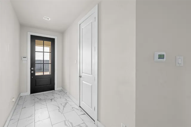 a view of an empty room and window