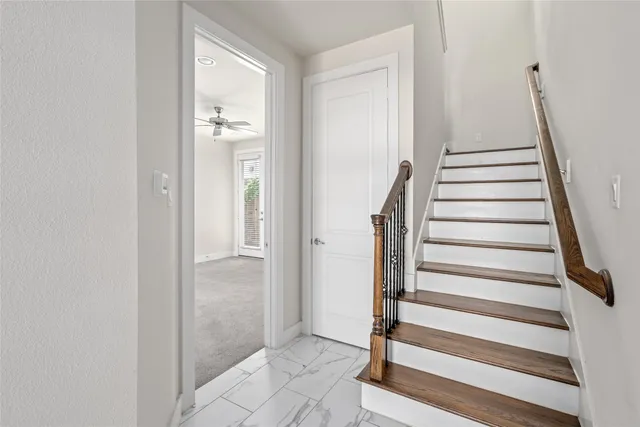 a view of entryway with wooden floor and windows